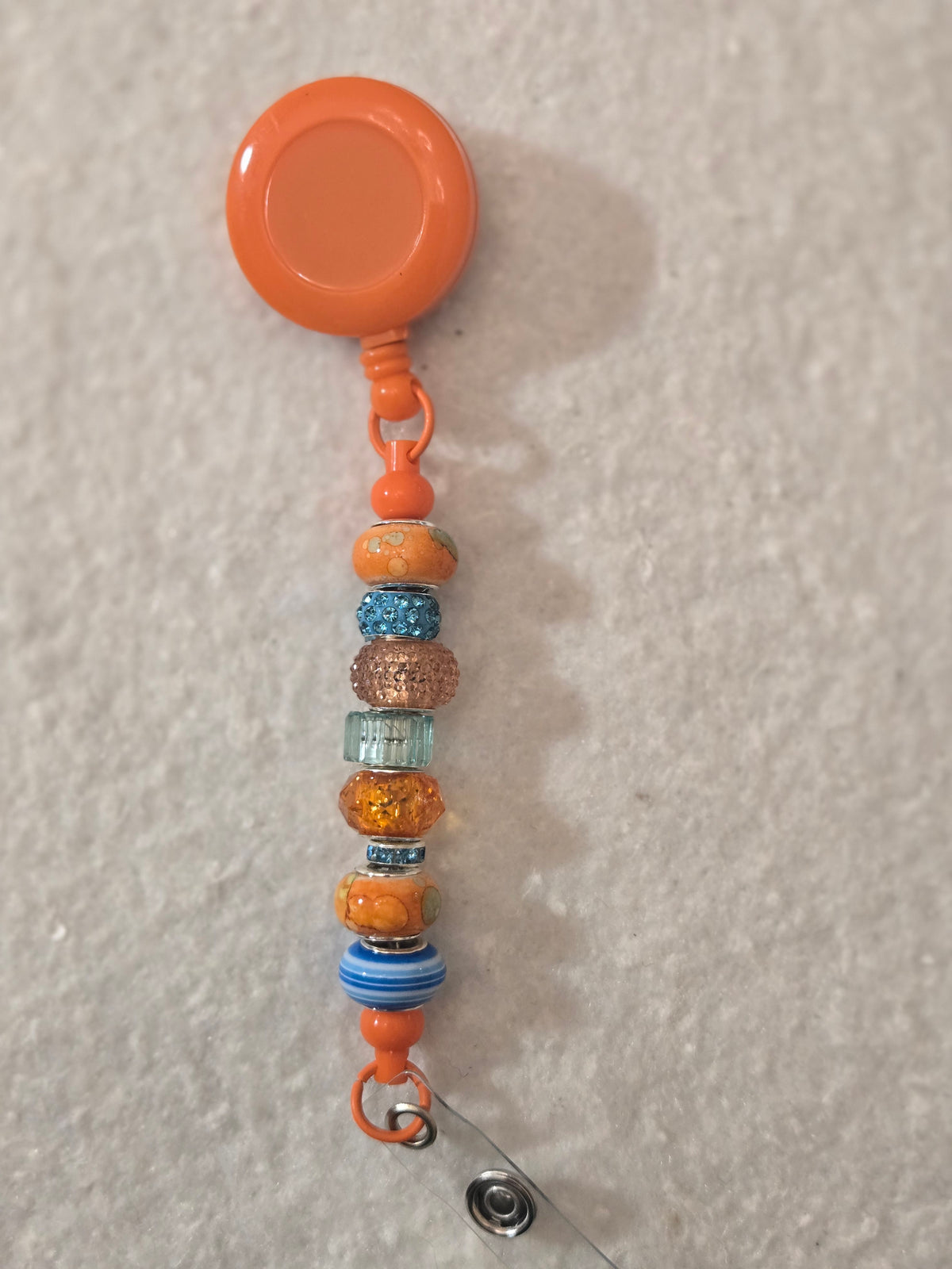 BH1 Orange and Turquoise badge holder