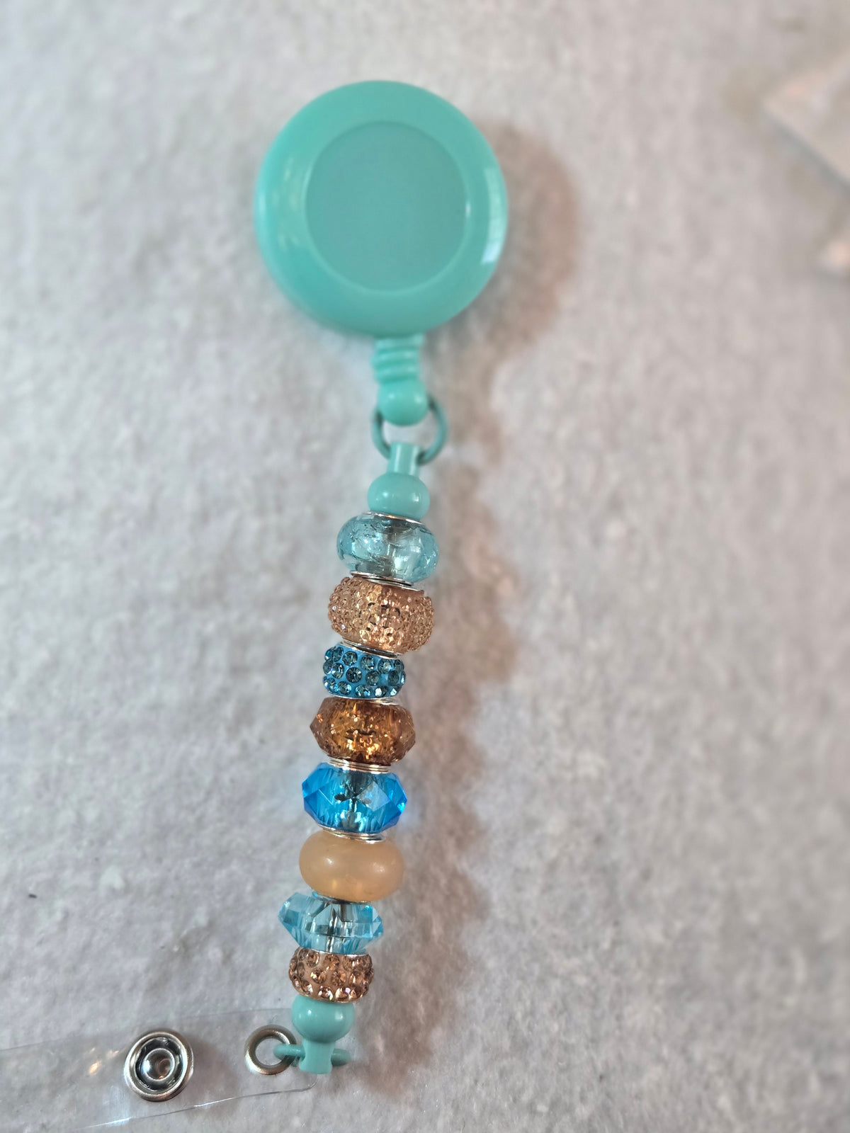 BH4 Brown and Teal Badge Holder