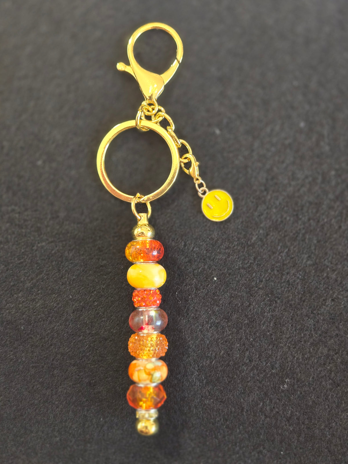 GL8 Orange Beaded Keychain with smiley face